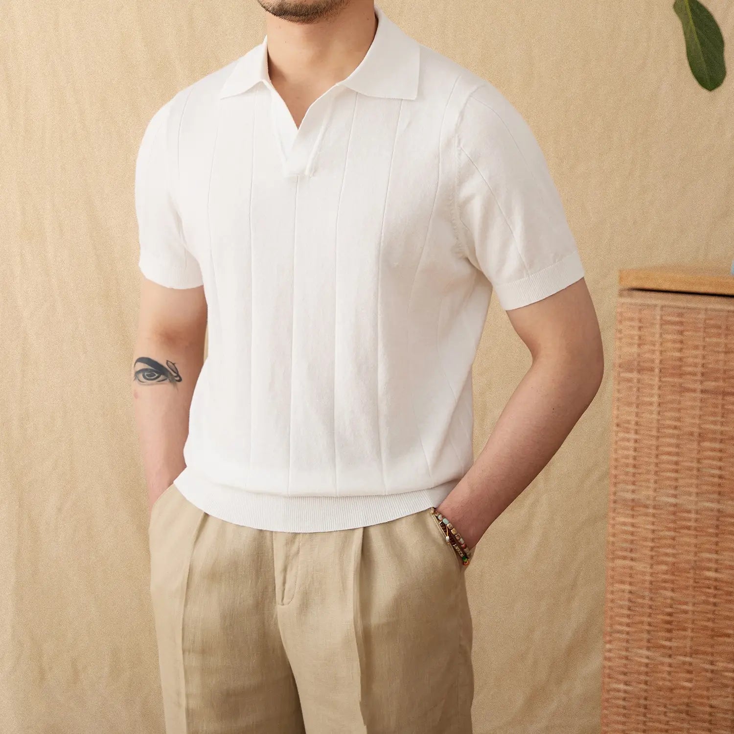 Men knit stripe polo shirt in white featuring short sleeves vertical ribbed detailing and a classic collar.