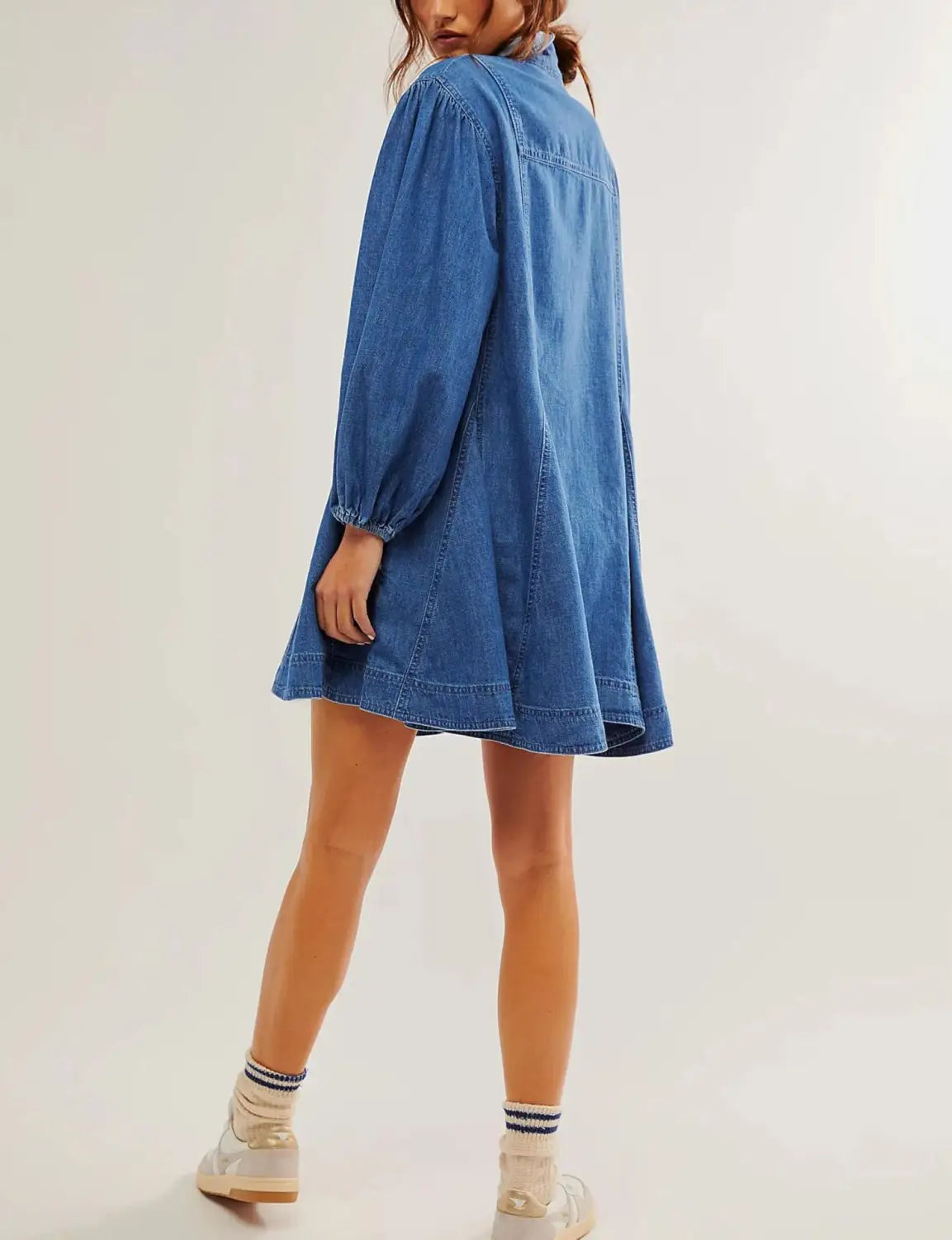 Blue denim lantern sleeve shirt dress featuring long puffed sleeves, patch pockets, and a flared skirt.