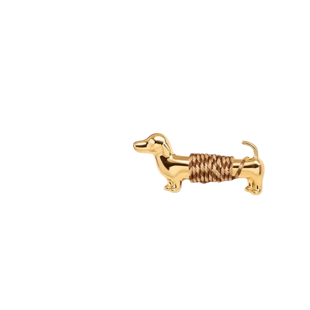 Gold-colored dachshund brooch with textured rope-like detail wrapped around midsection for animal lapel pin use