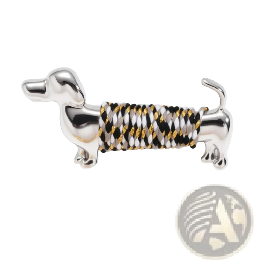 Silver dachshund brooch lapel pin with black white and gold braided cord wrapped body design