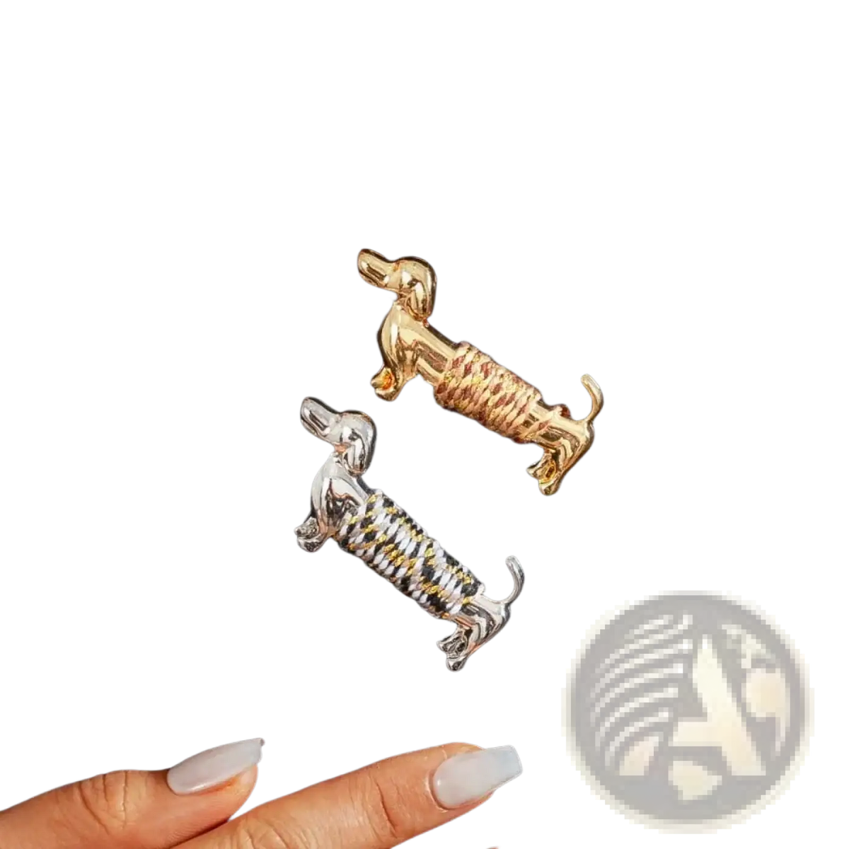 Two dachshund brooches featuring a gold-tone textured body and a silver-tone black and white striped design lapel pin