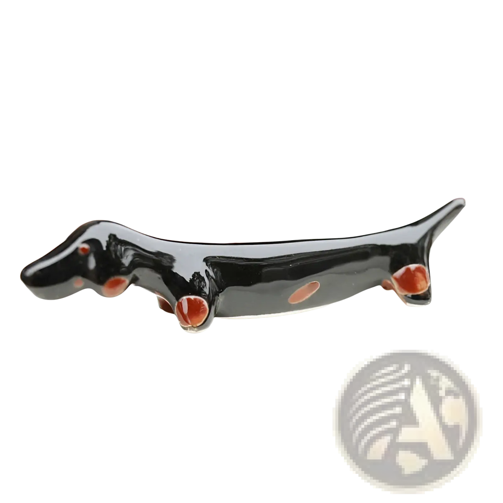 Black ceramic dachshund chopstick rest set of 4 with glossy finish and reddish brown accents on paws eyes and belly