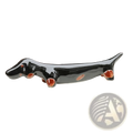Black ceramic dachshund chopstick rest set of 4 with glossy finish and reddish brown accents on paws eyes and belly