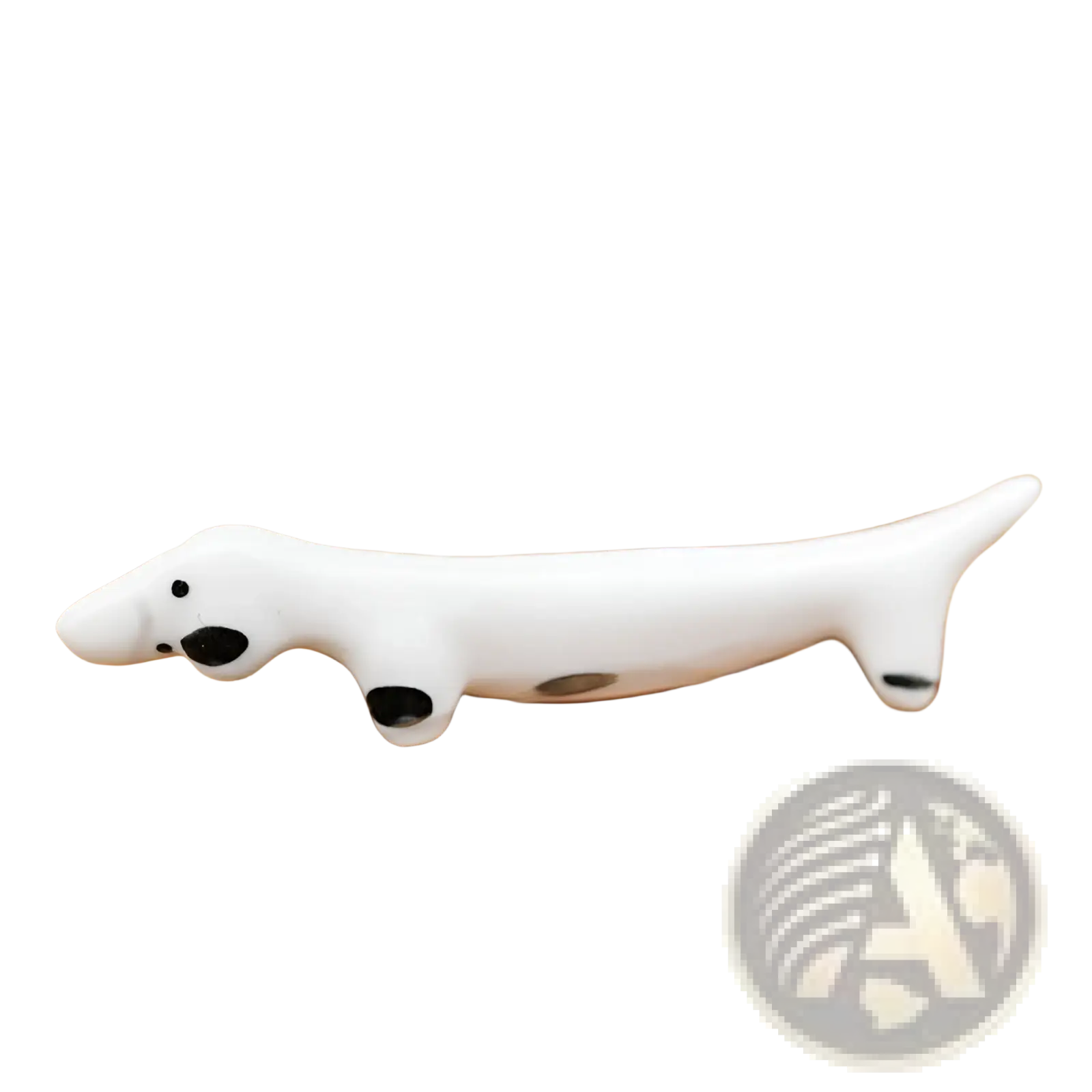 White ceramic dachshund figurine with black spots as a chopstick rest in a set of four pieces