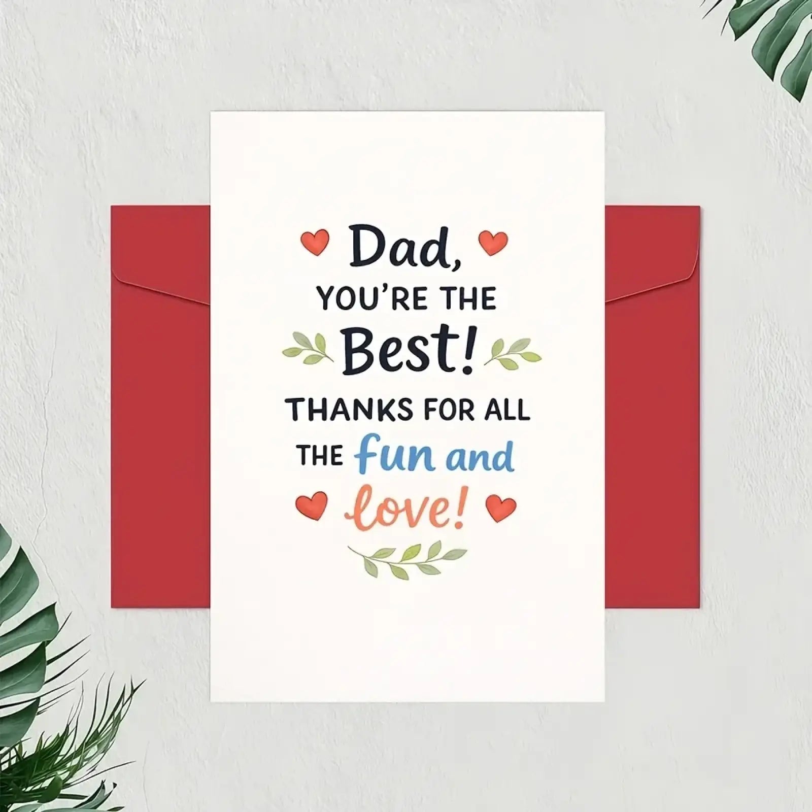 White dad fathers day greeting card with colorful text and heart motifs framed by red envelopes