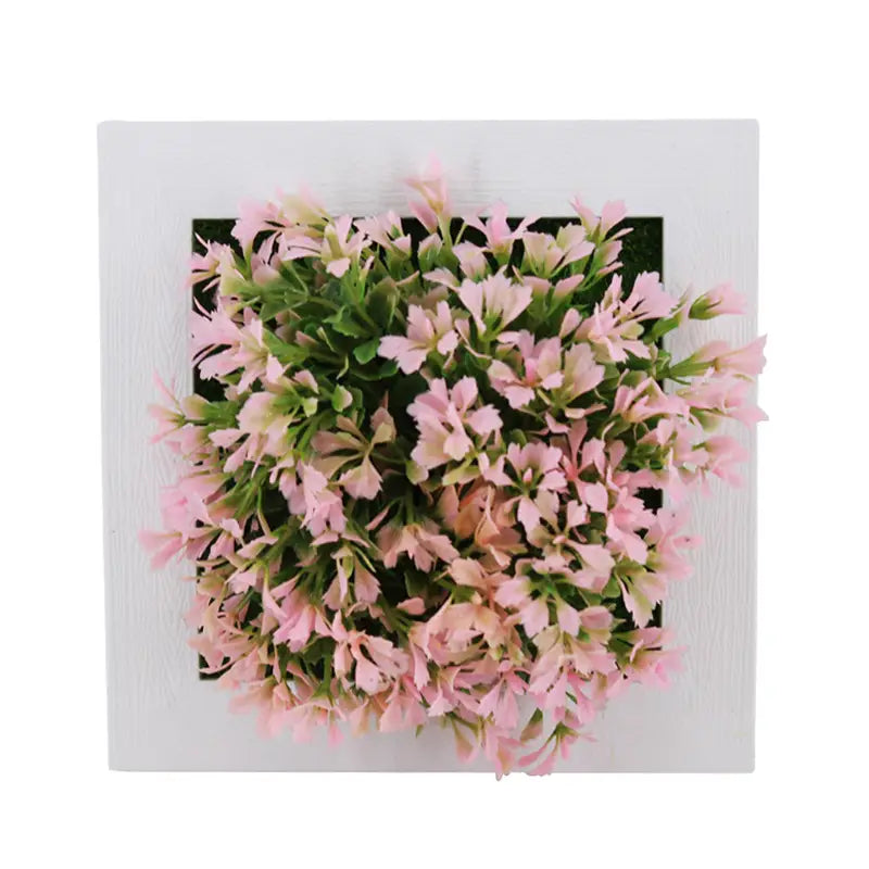 Succulent wall decor 3d artificial hanging plants featuring pink artificial flowers with green foliage in a square white frame.