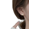 Gold four-leaf clover stud earring with clear crystal accents from daisy enamel flower clip on and stud earrings collection