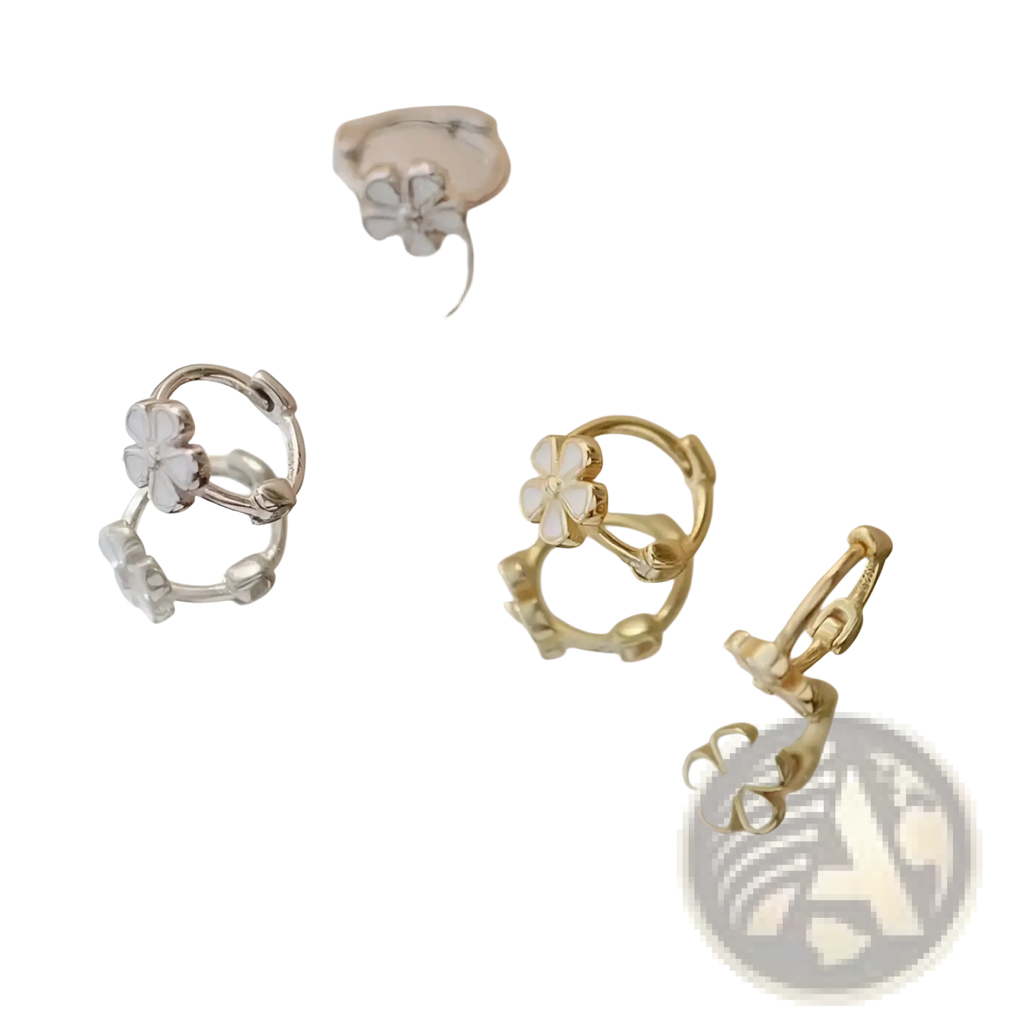Silver and gold-toned daisy enamel flower clip on and stud earrings with delicate four-petal white enamel centers
