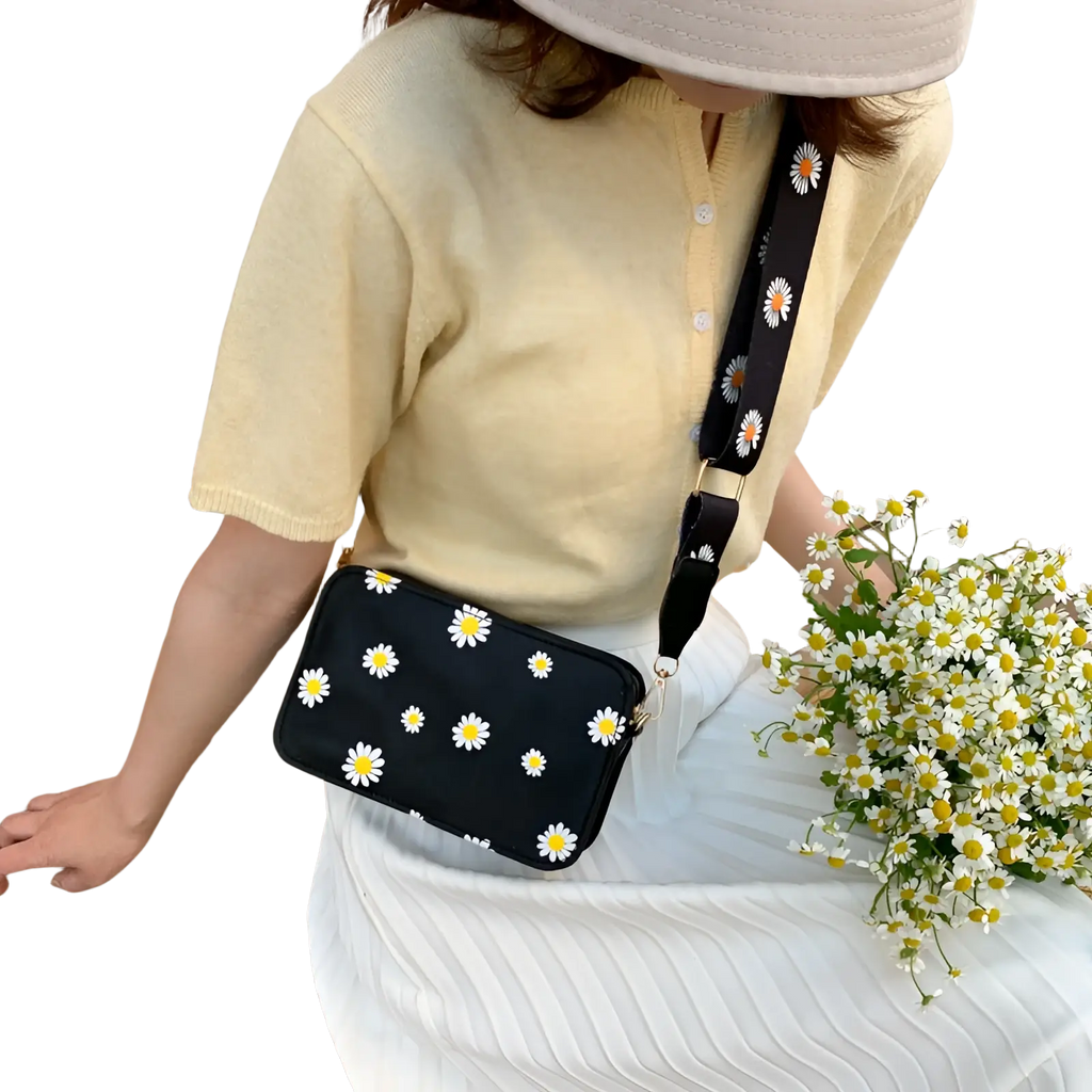 Black pu leather daisy flower crossbody bag with white embroidery and matching chain strap for everyday use
