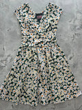 Retro Licious Greta 1950s cotton dress with a black base and white and yellow daisy print vintage style