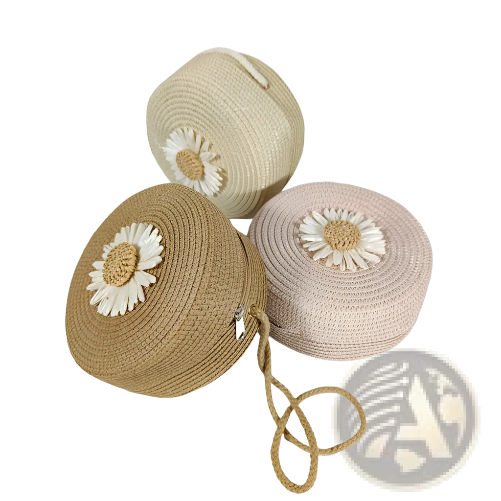 Three round woven straw crossbody bags in beige tan and blush pink with white daisy embellishments for shoulder use
