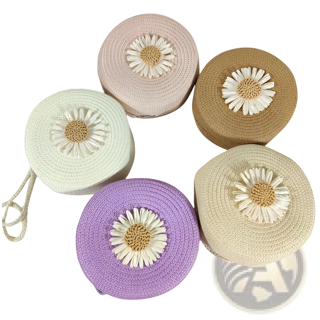 Pastel-colored round woven straw crossbody bags with embroidered daisy embellishments and shoulder straps