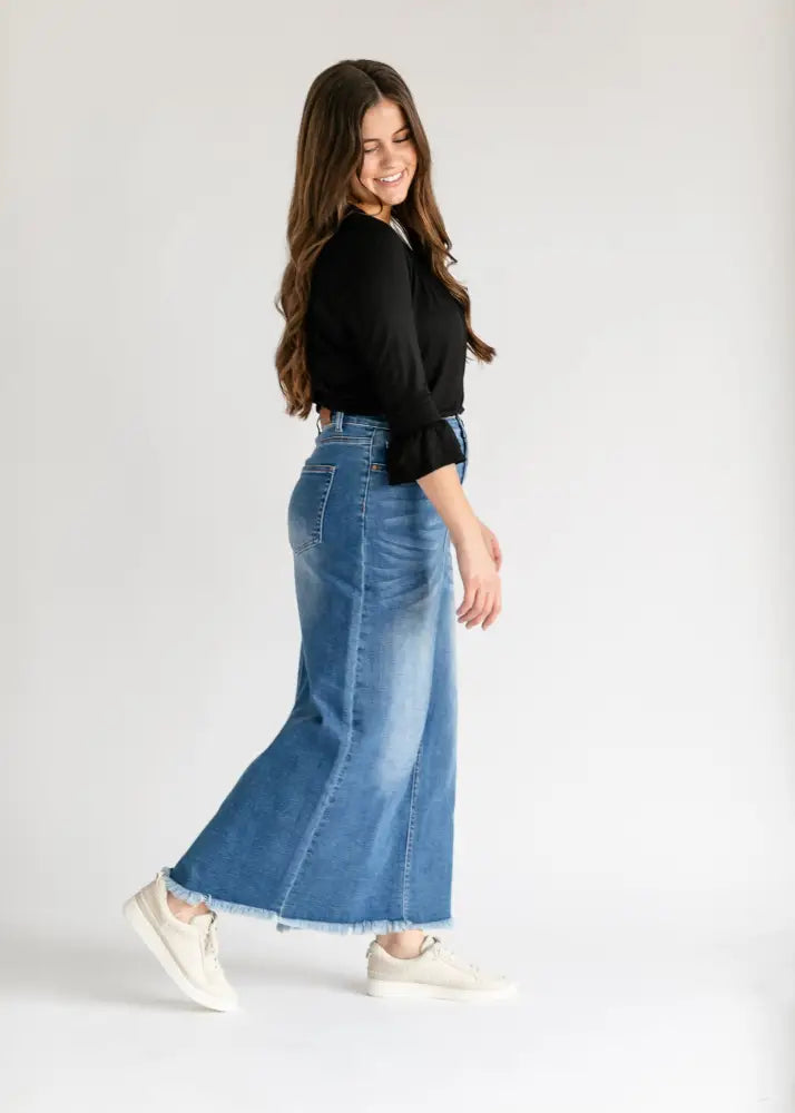 Dakotah raw hem high waisted denim maxi skirt in medium blue with frayed hem and classic five-pocket design