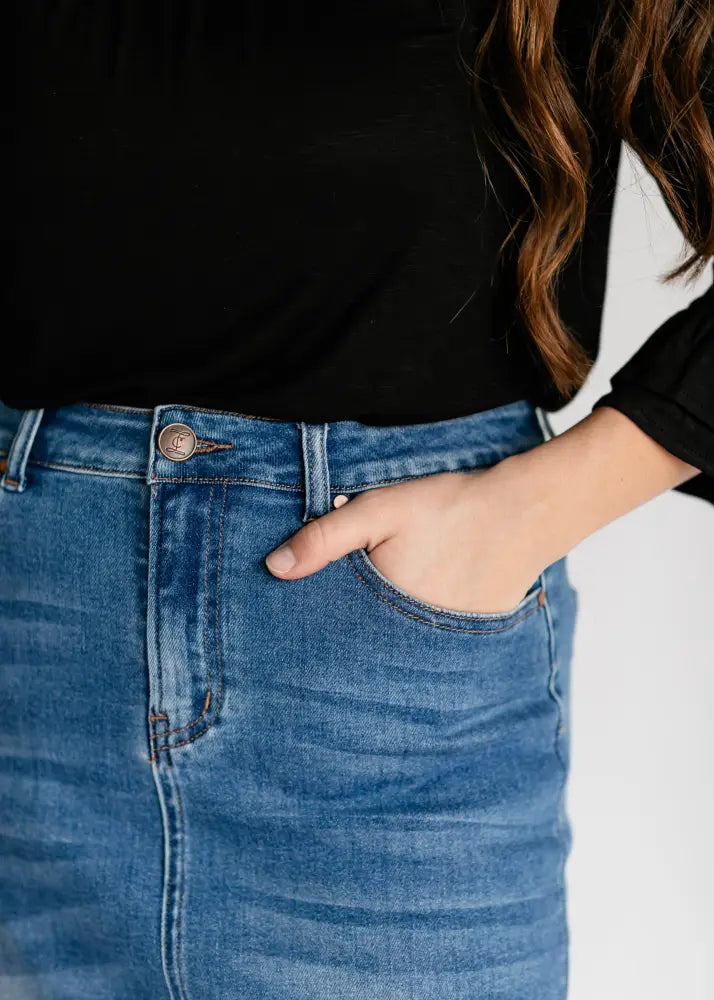 Dakotah raw hem high waisted blue denim maxi skirt with classic button closure and subtle fading details