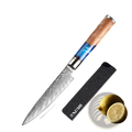 A 5-inch damascus steel utility knife with blue resin and wood handle displayed with black sheath from damascus chef knife set