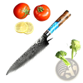 Damascus steel chef knife with a blue resin wood handle featuring a patterned blade for precise cutting