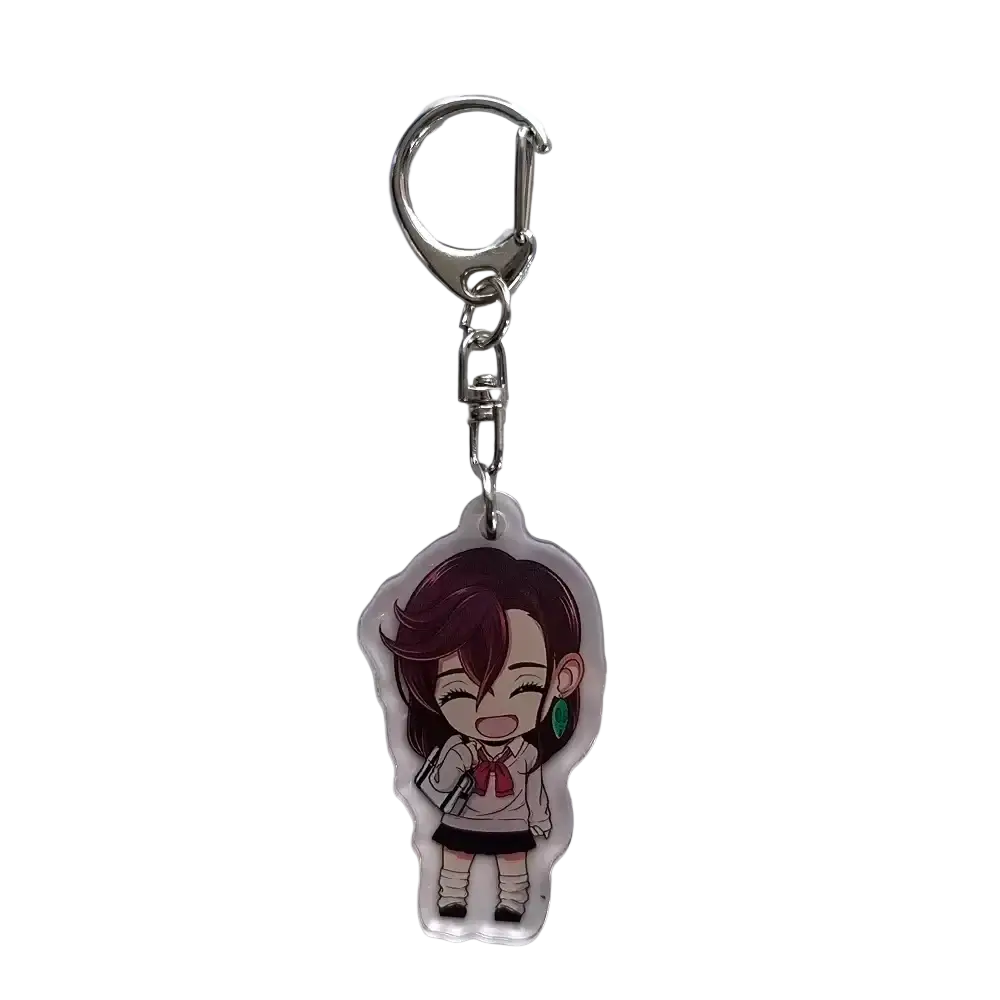 Clear acrylic dandadan anime keychain featuring a chibi momo with brown hair in white blouse and black skirt