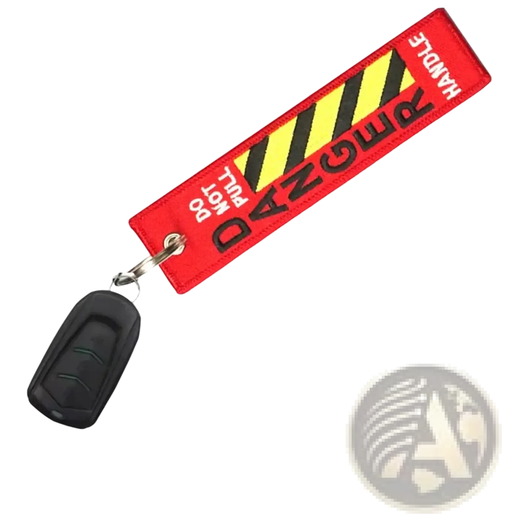 Red embroidered aviation warning tag keychain with black and yellow stripes and handle with care text for jdm motorcycle use