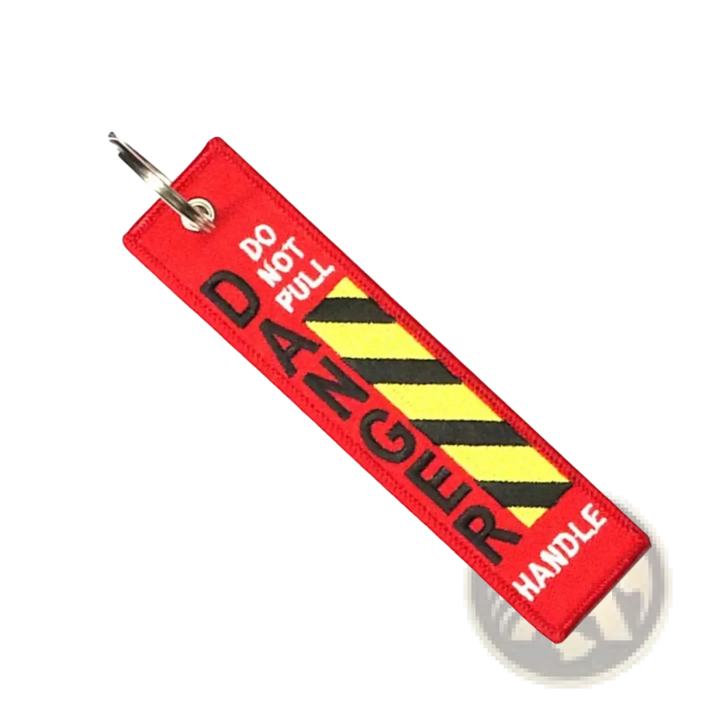 Red embroidered danger warning embroidery keychain with black and yellow hazard stripes and do not pull danger handle text