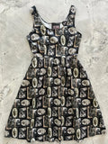 Black sleeveless cotton dapper dogs vintage fit and flare dress with pockets and sepia grayscale oval photo pattern