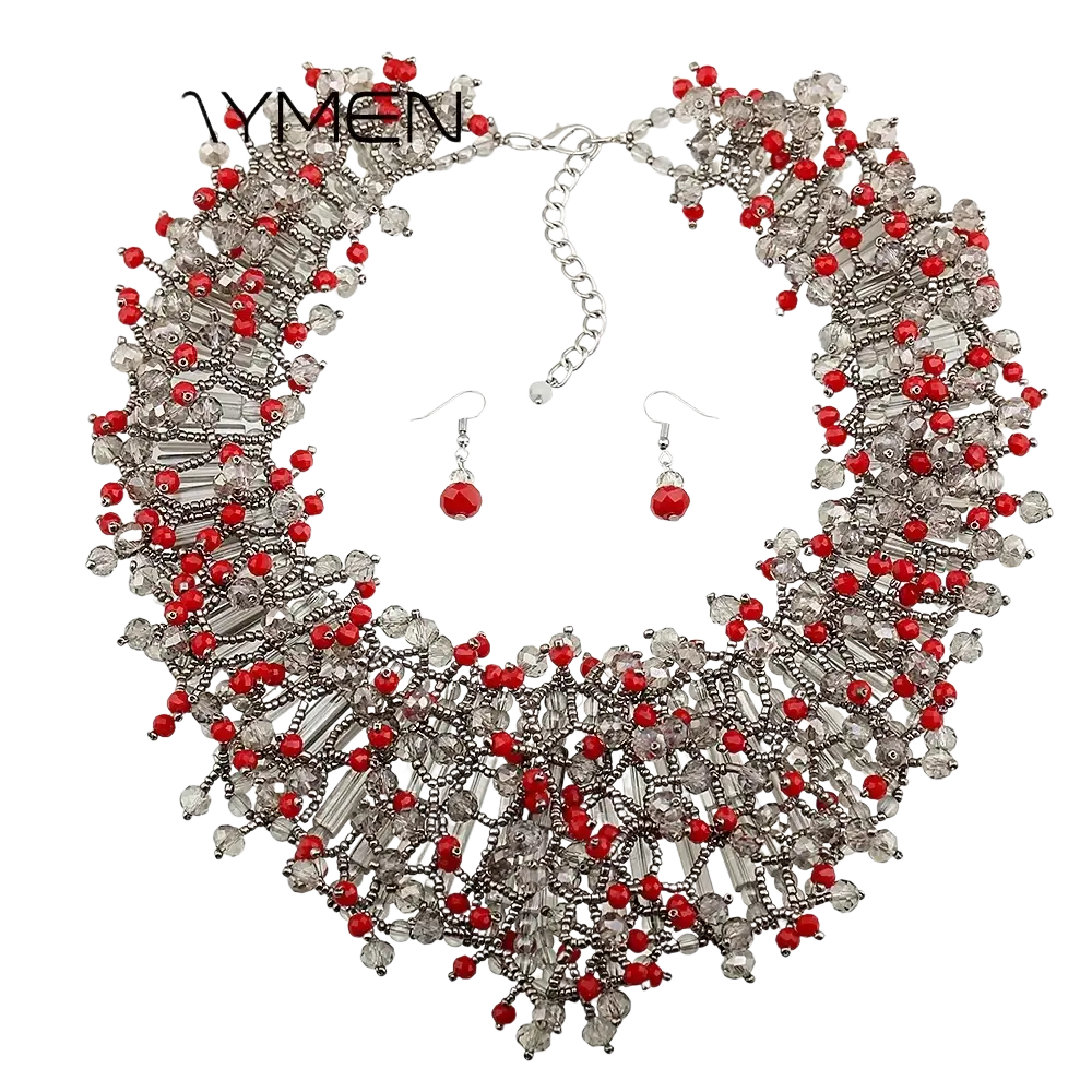 Red and clear crystal beaded statement necklace with silver-toned metal accents in a dark blue crystal statement necklace set