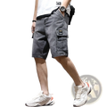Dark gray denim cargo shorts with subtle fading and a cargo pocket designed for youth workwear use