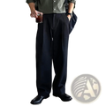 Dark gray pleated wide leg dress pants for men with tailored fit and subtle sheen in black fabric