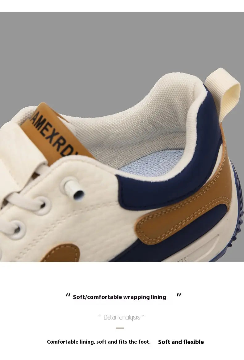 Men’s casual sports sneakers featuring white and navy blue canvas with tan leather accents designed for non-slip microfiber comfort.