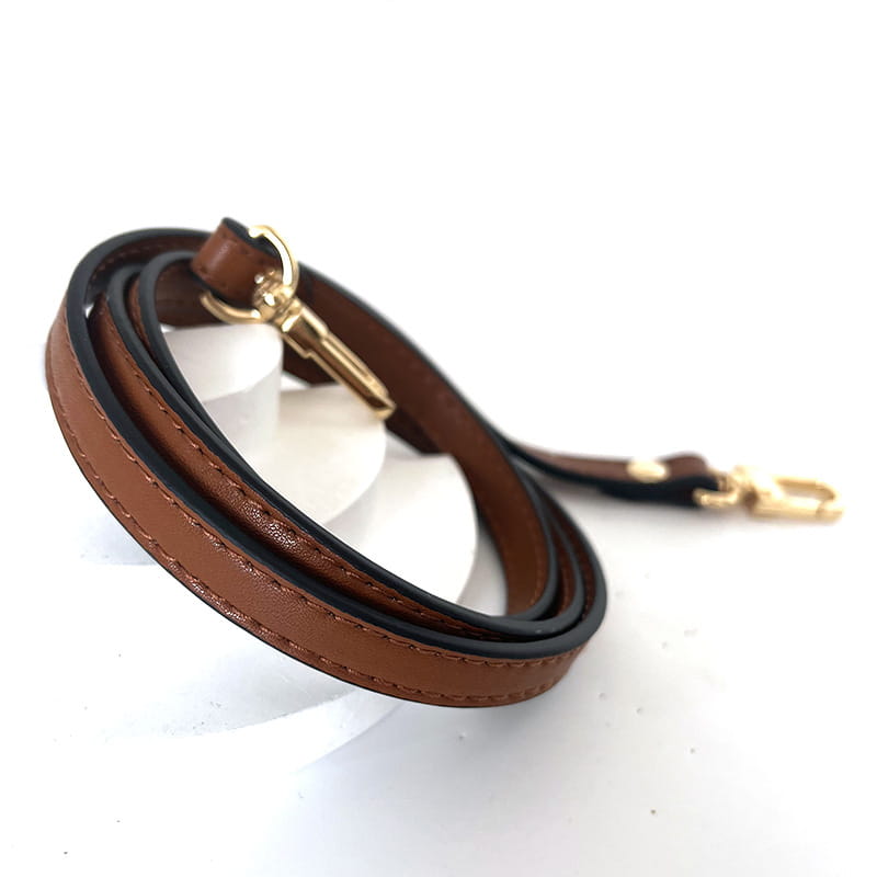 Leather replacement strap for crossbody bags in brown leather with black inner lining and gold-tone metal hardware.