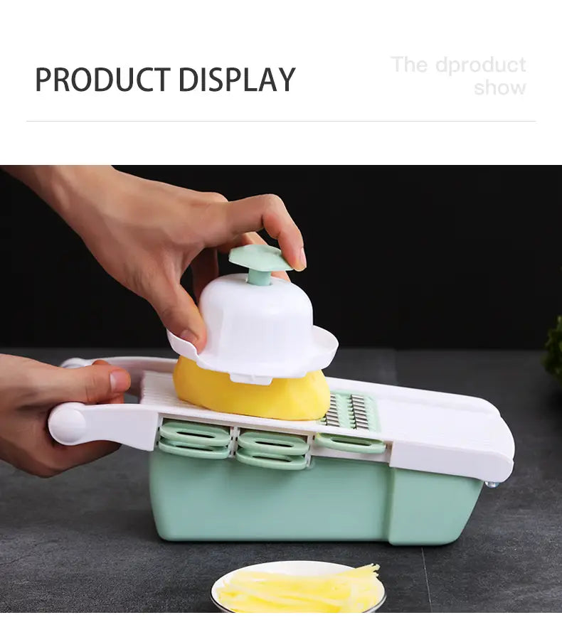Vegetable slicer mandoline grater with interchangeable blades for different cutting styles in a white and mint green plastic body.
