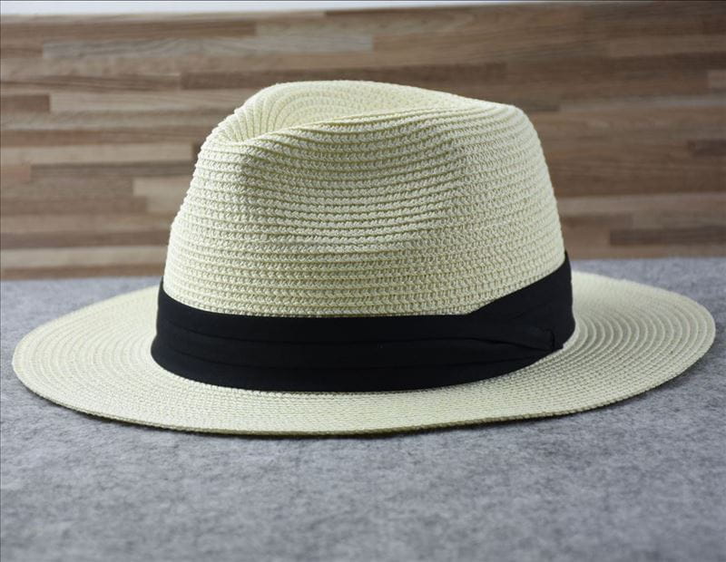 Beige woven straw fedora hat with black ribbon band designed for foldable sun protection for men.