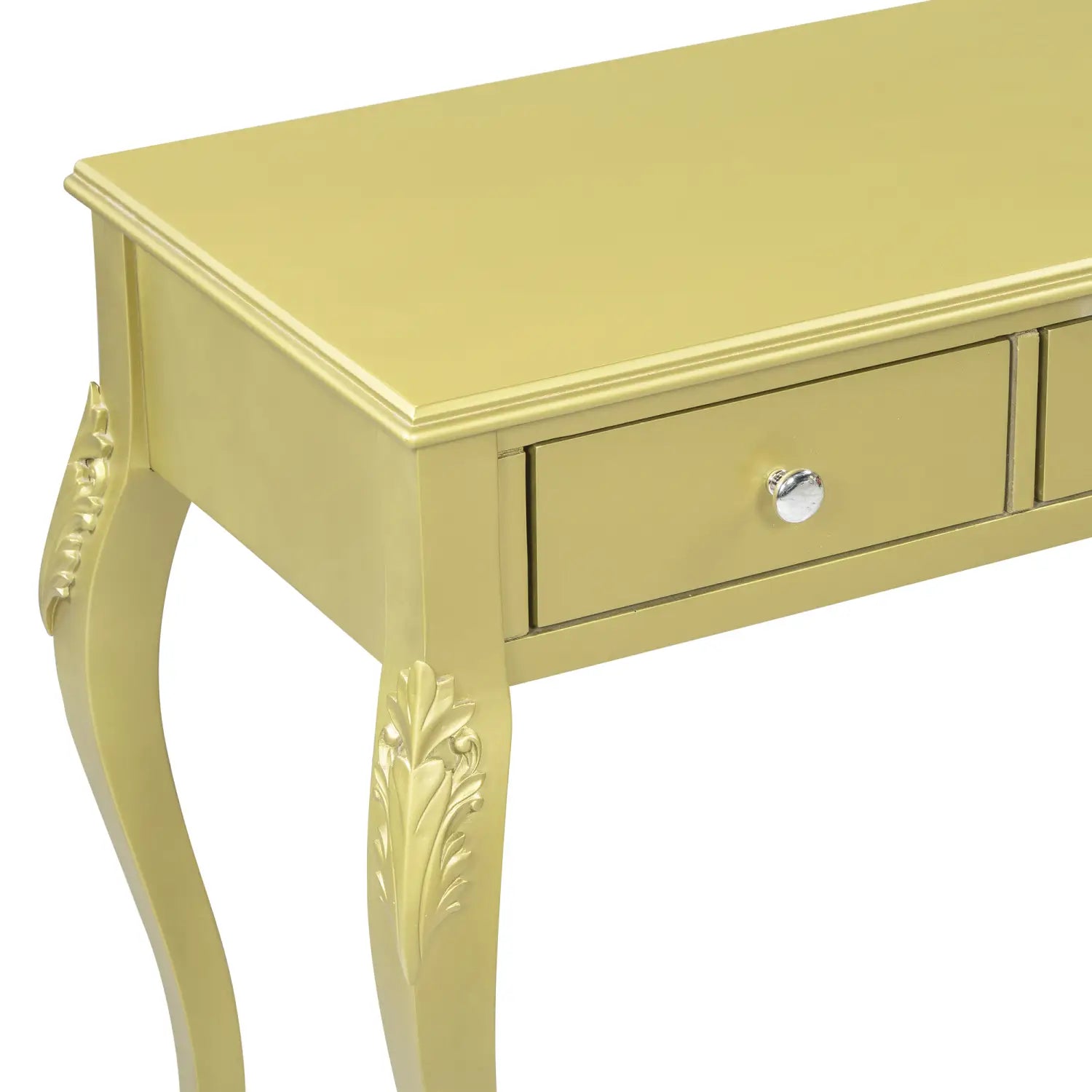 A pale yellow ornate console table with carved leaf details on its curved legs and a silver round knob on the drawer featured in a gold makeup vanity desk with oval mirror and three drawers.