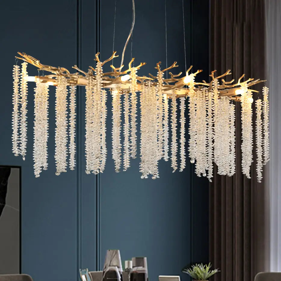 39 inch golden crystal waterfall pendant light featuring a golden branch-shaped chandelier adorned with cascading strands of clear crystal beads.
