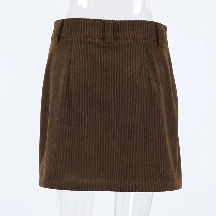 Brown corduroy mini skirt with a classic pleated design and belt loops from the Retro corduroy mini skirt with matching belt collection.