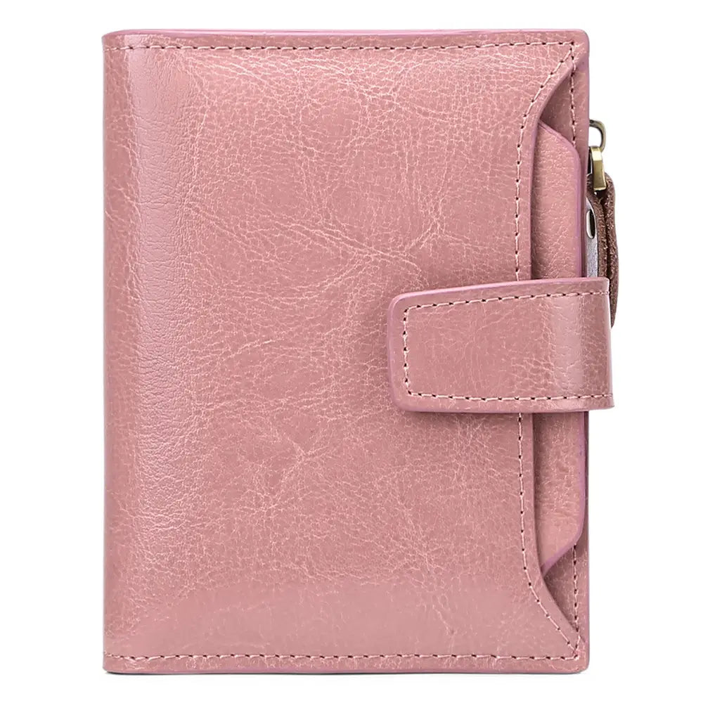 A pink textured leather rfid wallet with flap closure zipper pocket and anti theft feature.