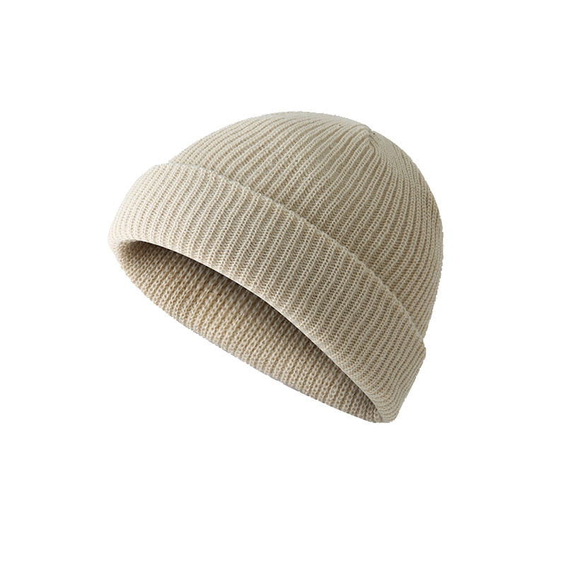 Dark gray ribbed wool beanie hat featuring a beige ribbed knit beanie with a folded cuff.