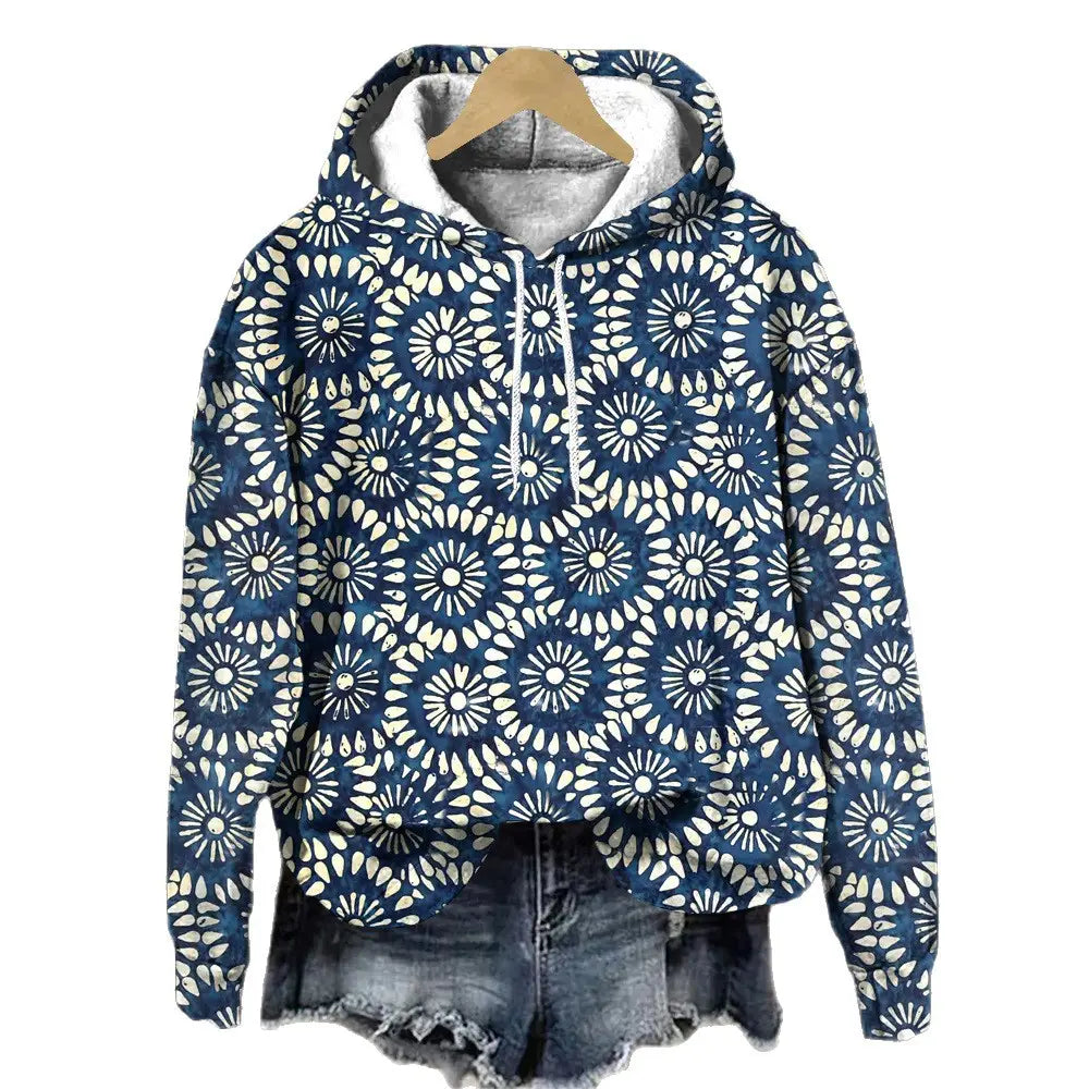Sudadera con capucha de ajuste holgado con estampado floral en azul y blanco, con interior forrado de felpa suave y patrón floral.