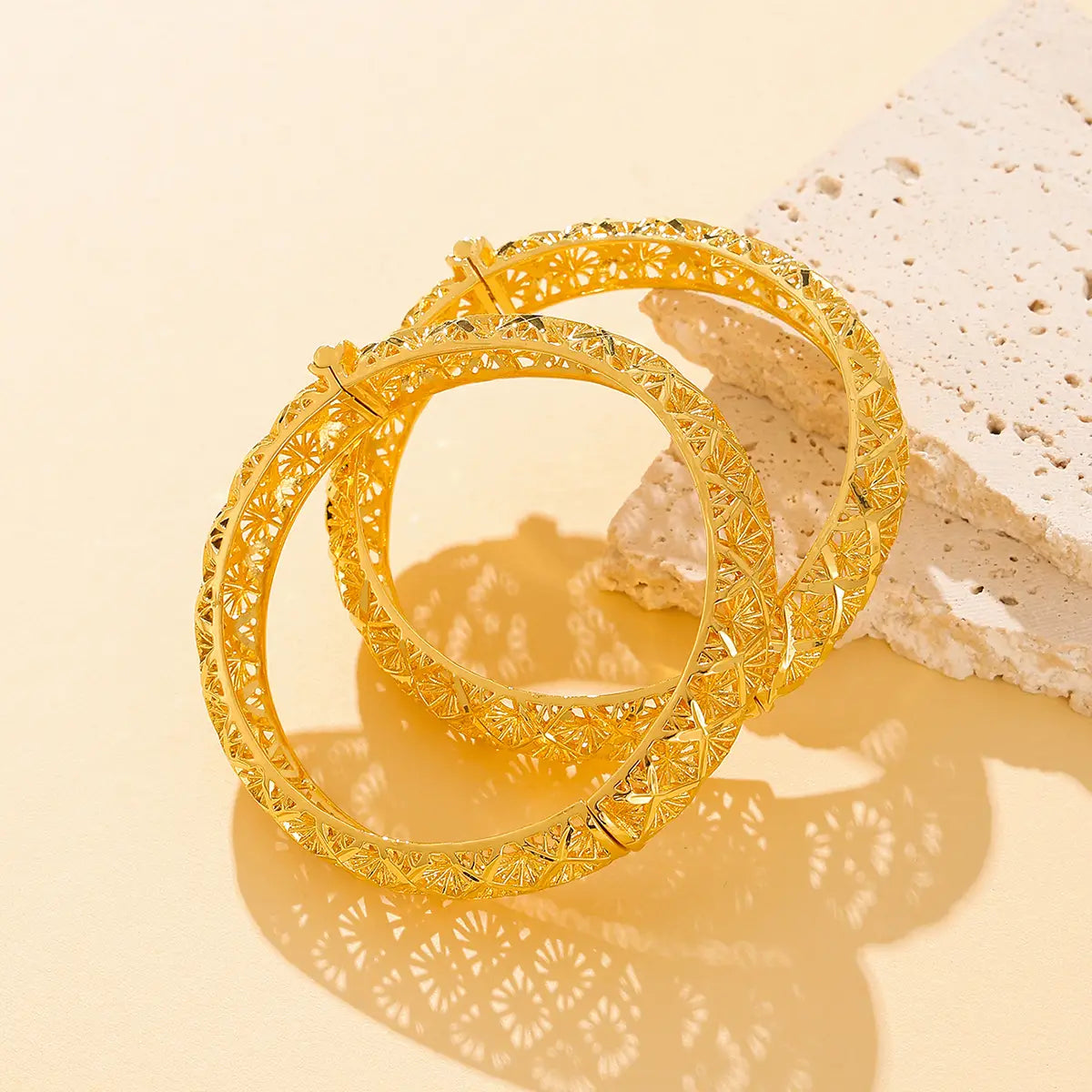 vintage 18k gold plated filigree four leaf clover bangle featuring golden intricately patterned bangles with a delicate filigree design