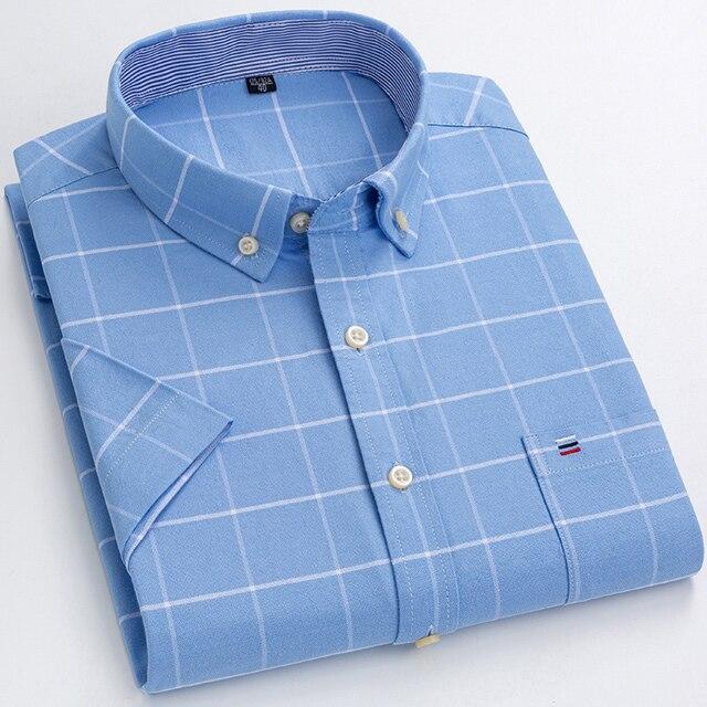 Men’s premium 100 percent cotton textured short sleeve shirt in light blue with a white grid pattern and a small logo on the chest pocket.