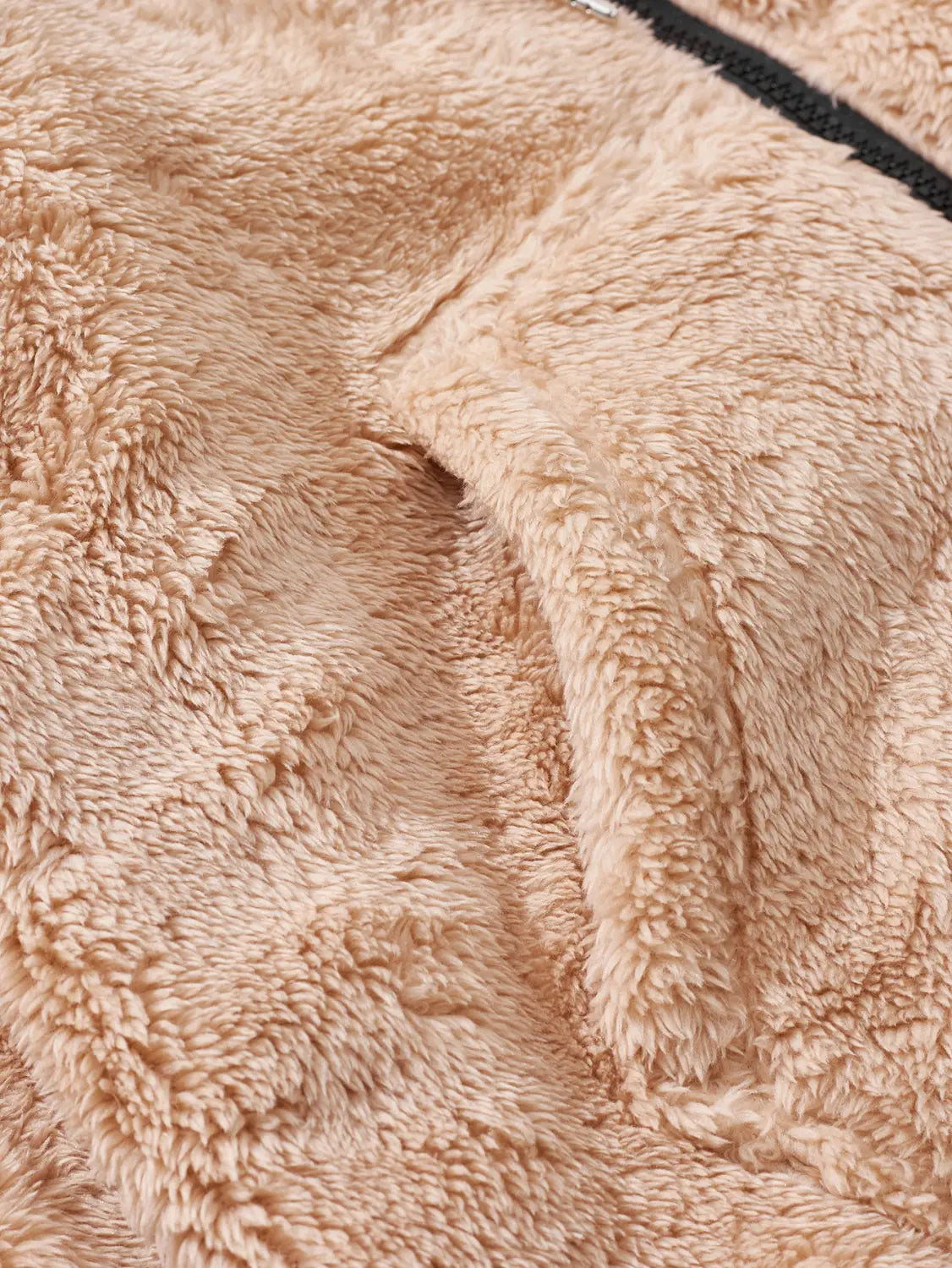 Beige men’s fleece lined loose zip up hooded jacket made of plush fleece with black zipper detail.