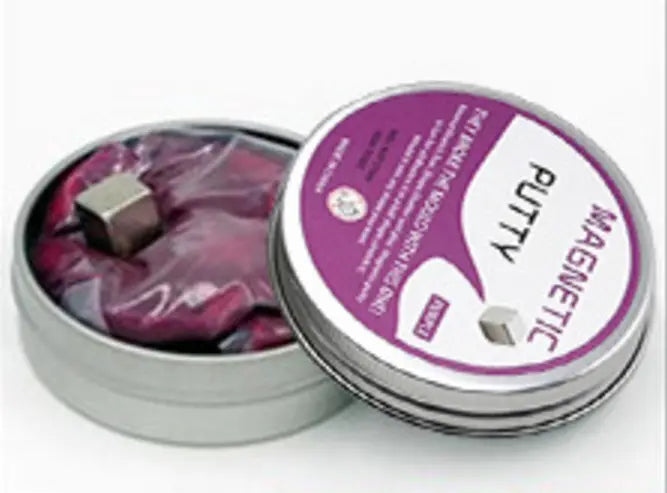Purple magnetic putty in a silver tin with a small metallic cube embedded inside from the magnetic putty stress relief toy 6 color set.
