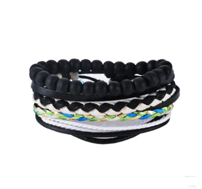 Handmade multilayer braided leather and wood bead bracelet featuring stacked leather and beaded bracelets in black white and multicolored woven patterns.