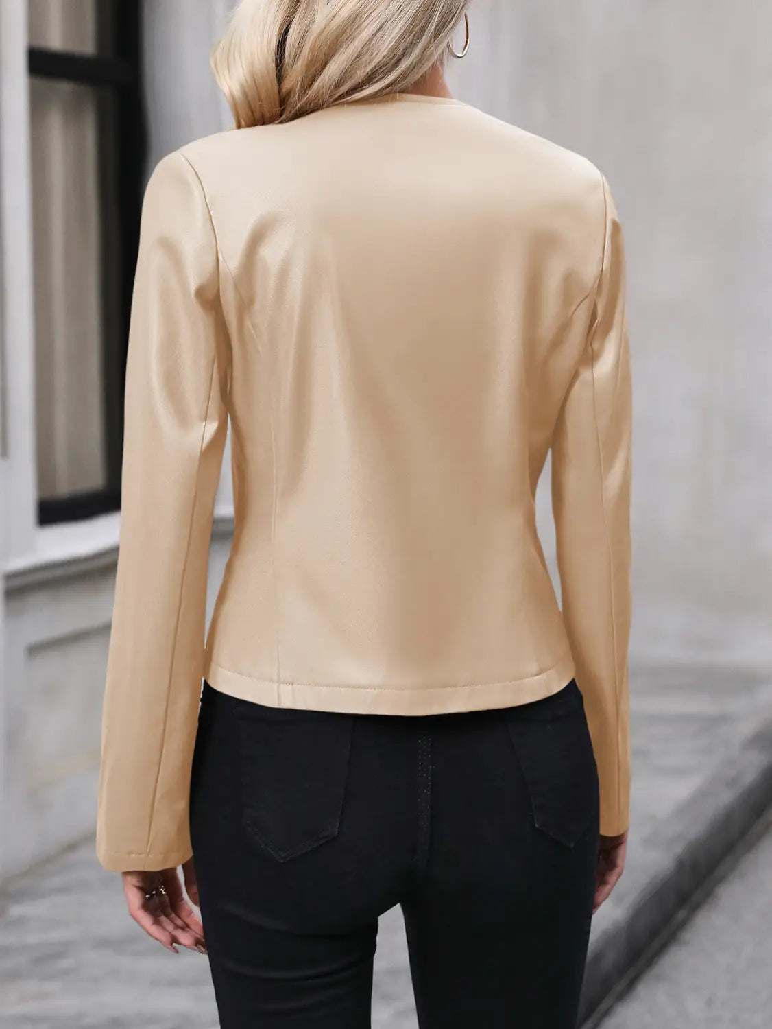 Beige faux leather moto jacket with long sleeves and a fitted silhouette, designed as women’s faux leather bomber jacket long sleeve outwear.
