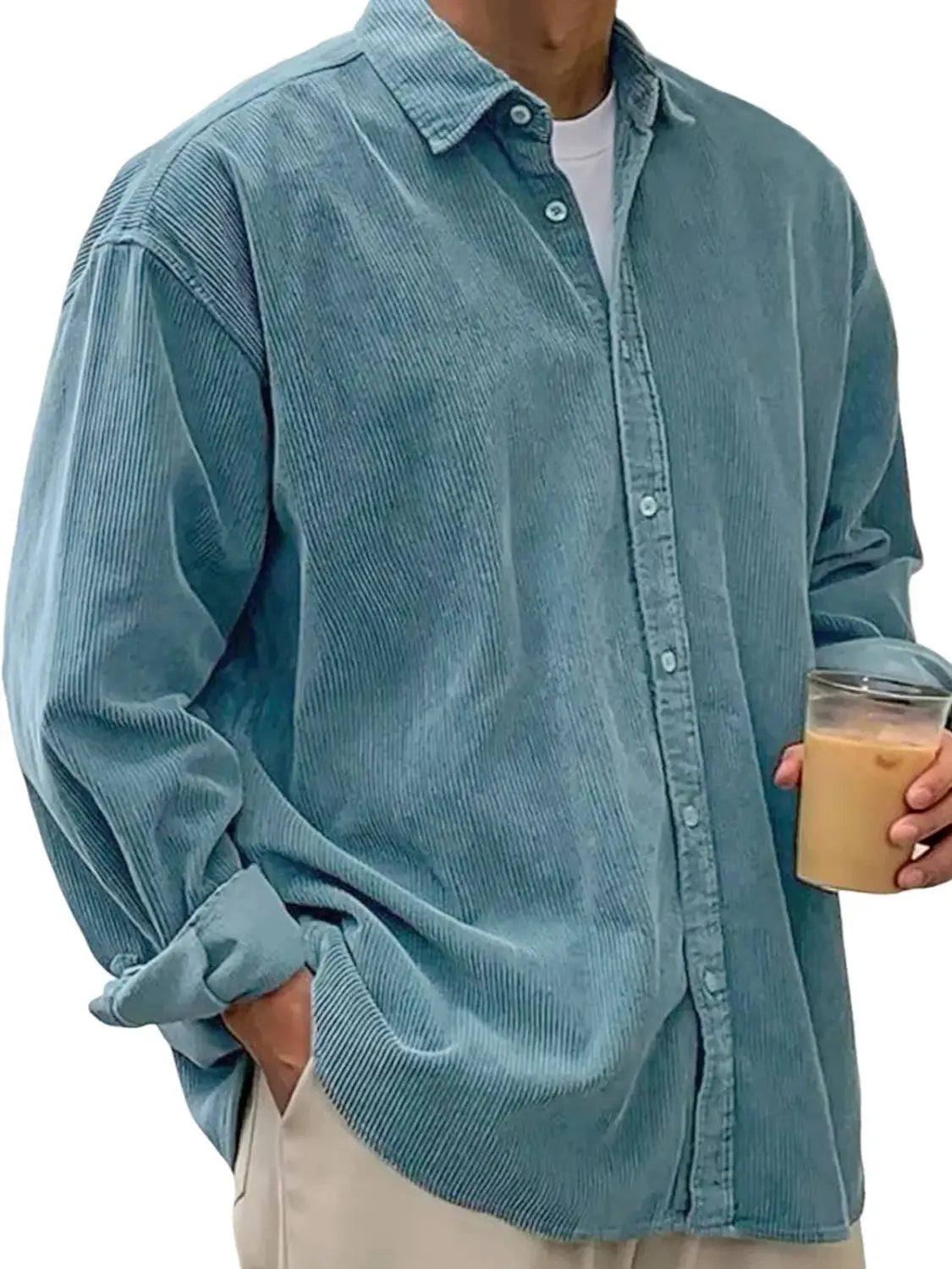 A light blue men’s relaxed fit shirt jacket made of corduroy with a button-up front and rolled-up sleeves.