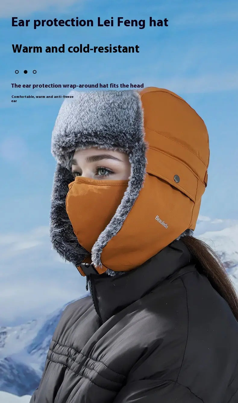 Orange and gray fleece-lined winter ushanka hat with ear protection and soft fleece lining for cold weather use.