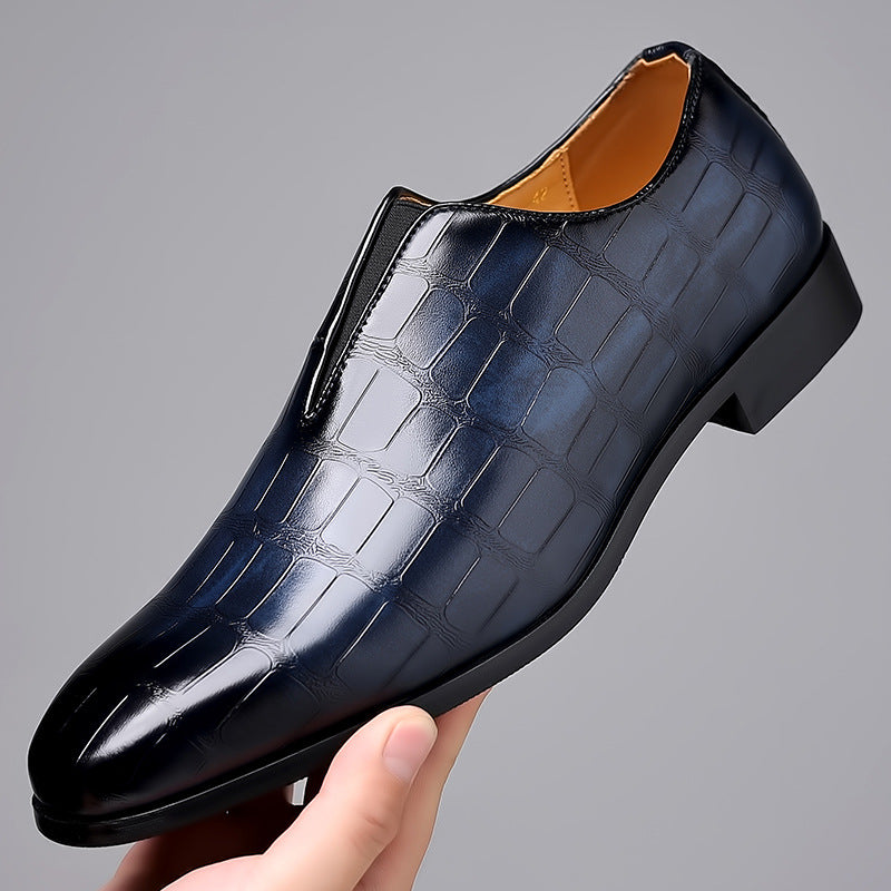 Black crocodile-embossed leather slip-on men’s dress shoe with glossy finish and black rubber sole Embossed Stone Pattern Loafer
