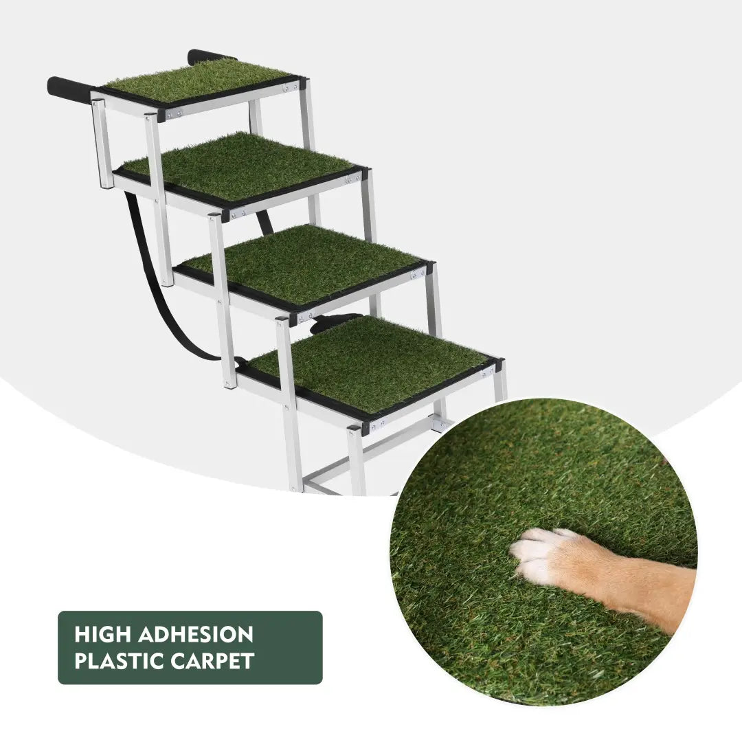Silver metal foldable dog ramp with four green artificial grass carpeted steps designed for cars and SUVs with 250lb capacity.