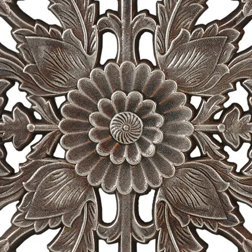 bronze-colored metal wall decor featuring intricate floral design from the carved wood wall decor set distressed botanical panels