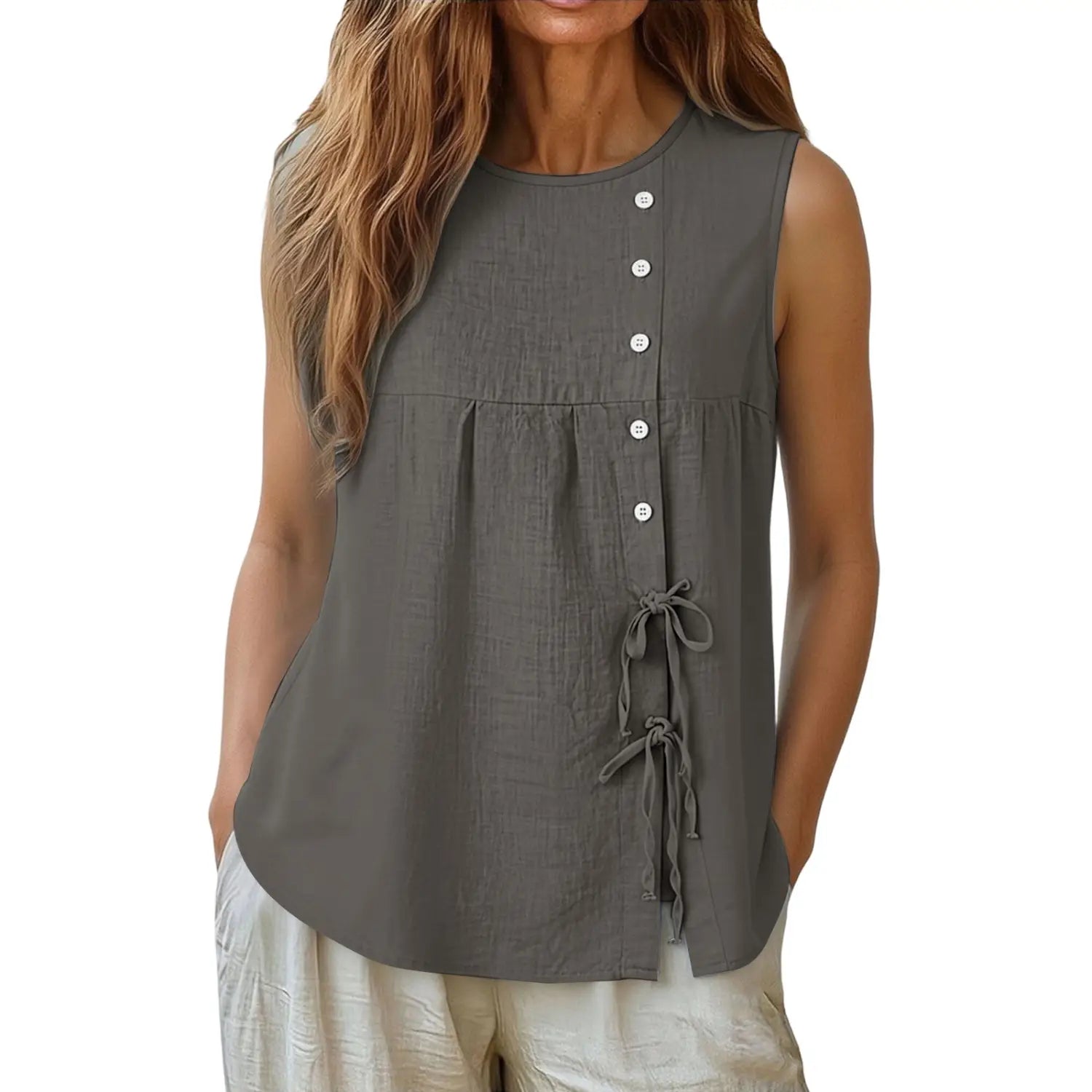 A sleeveless olive green linen blouse with a button down front and tied side details.