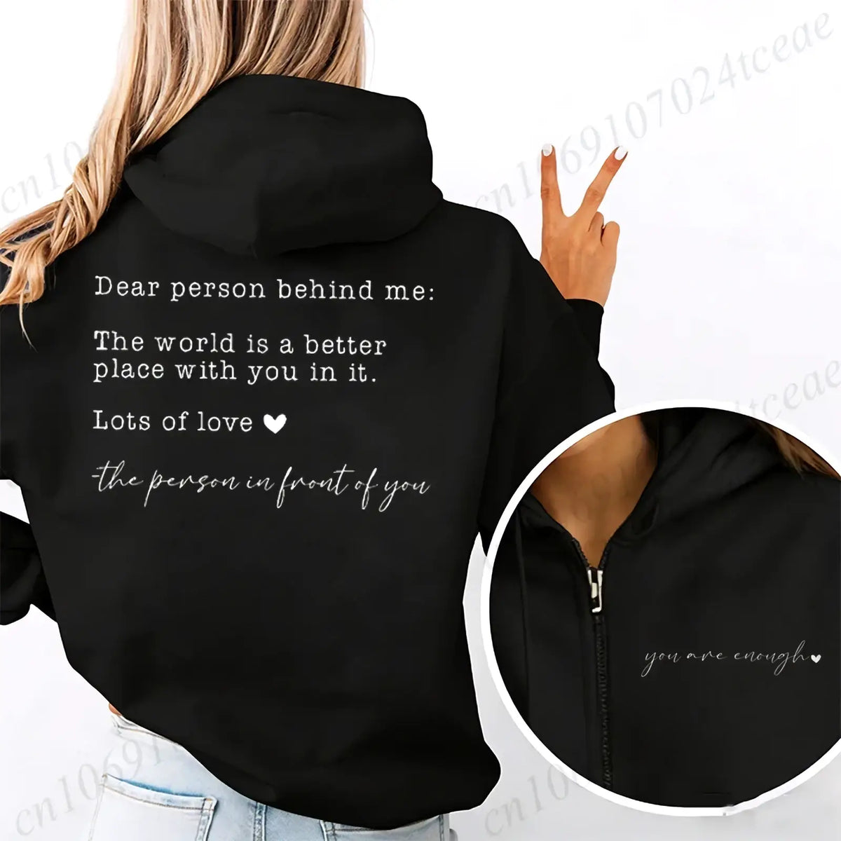 Black zip up hoodie with white text on the back reading dear person behind me the world is a better place with you in it
